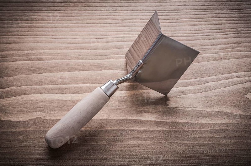 Hand angle former with wooden handle on wood board