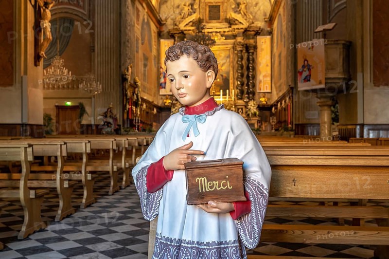 Altar boy sculpture with Merci donation box for the collection in the Catholic Cathedral Notre-Dame de l'Assomption, Ajaccio, Corsica, France