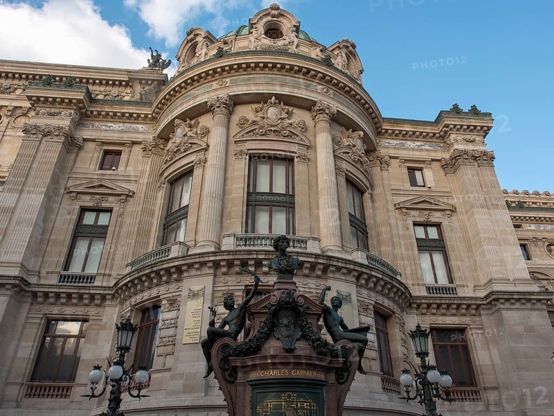Fascinating front view of a magnificent opera house with richly decorated façade elements and statues, paris, france