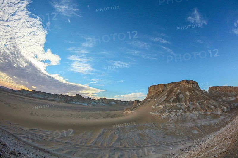 Late afternoon sun casting shadows on rocks in the Libyan desert white desert, Farafra, Egypt