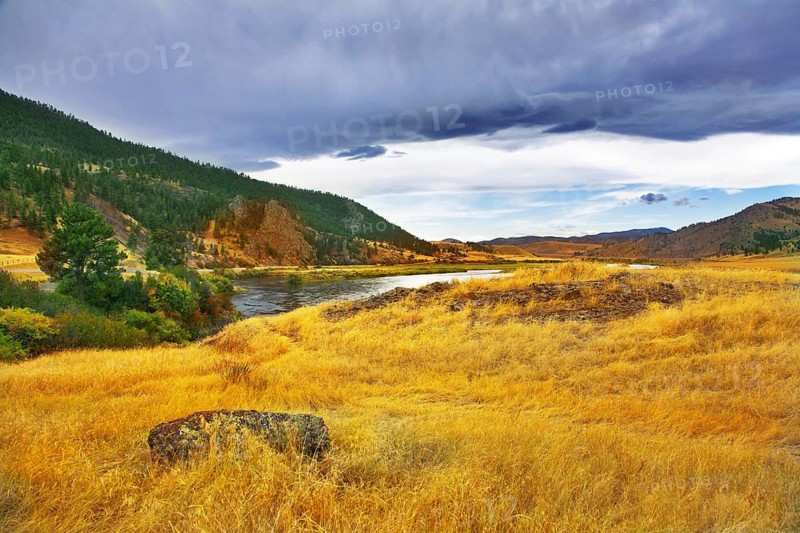 The river Missouri is beautifully bent between brightly yellow meadows