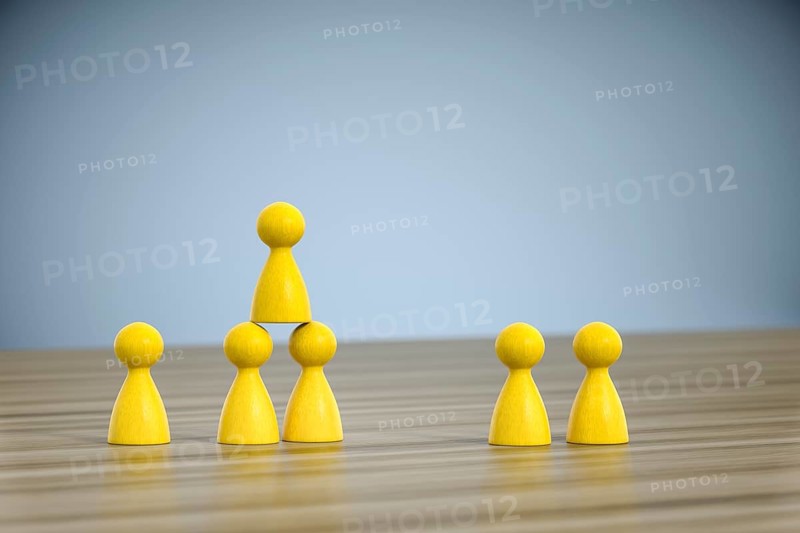 3d illustration of some game figures building a pyramid