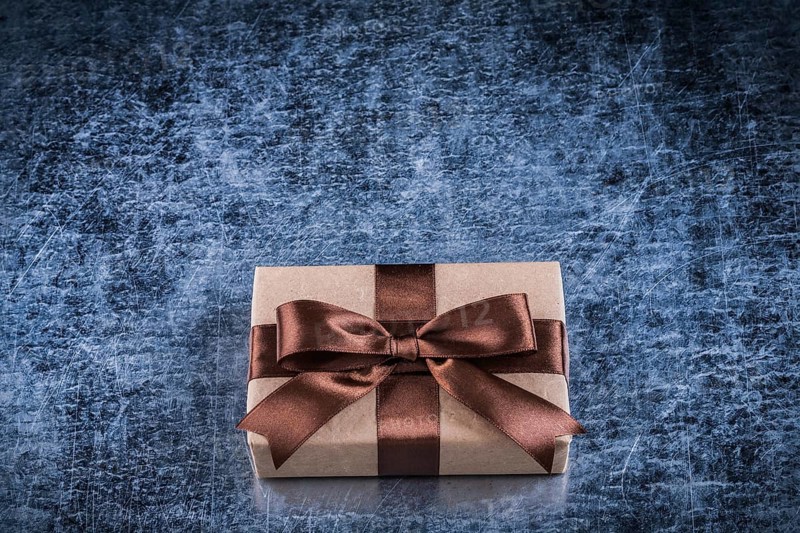 Vintage present box on scratched metallic background holidays concept