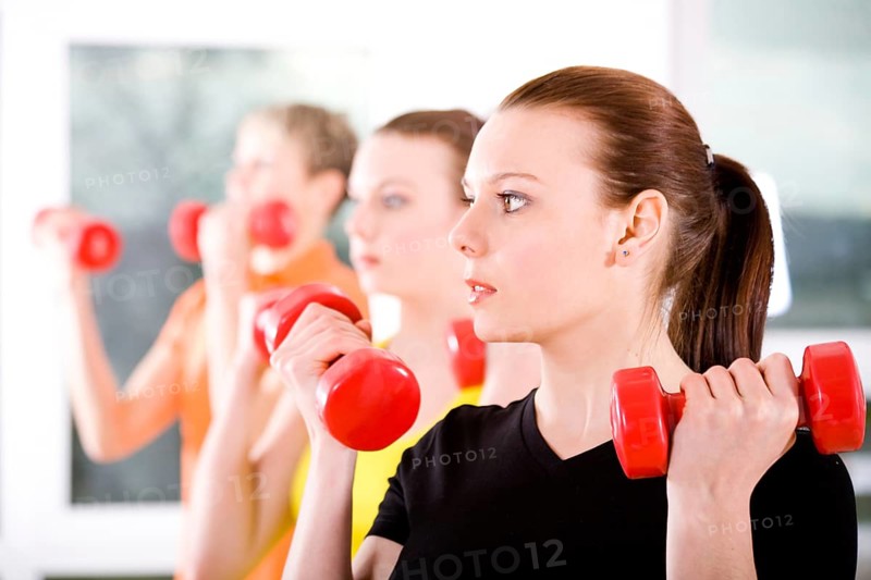 Young women exercising in a step aerobics class