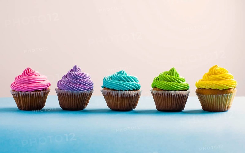 Vivid colous cupcake in a row. Different choices during the life