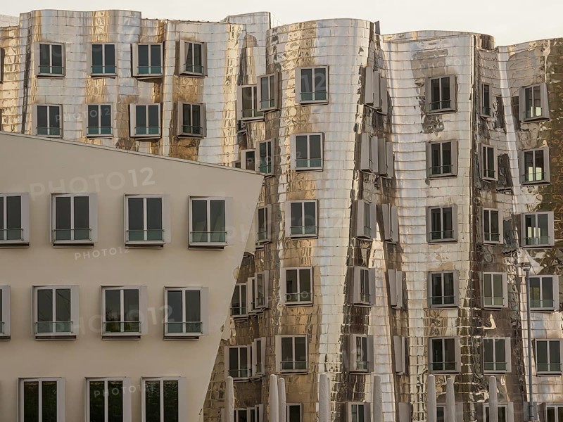 Detailed view of modern, distorted buildings with reflective facades and many windows, düsseldorf, North Rhine-Westphalia, germany