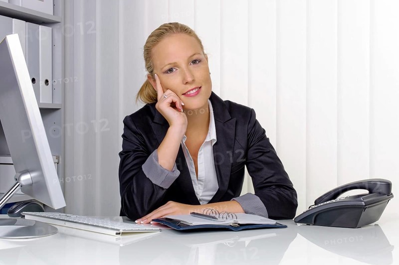 A secretary in the office at her daily work, 35 years, Thoughtful studio shot, Federal Republic of Germany