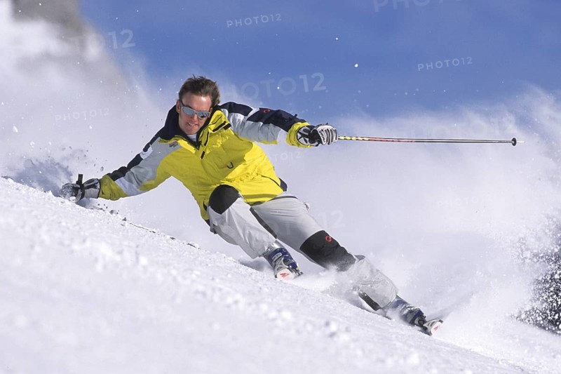 Skiers in action, deep snow, Austria