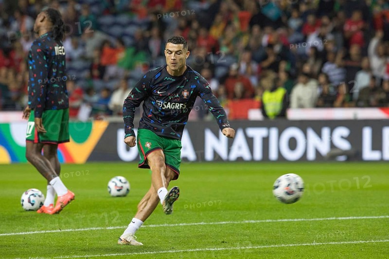 Football match, Cristiano RONALDO CR7 Portugal warming up in front of the match with left foot shot and closed eyes, Estadio do Dragao, Porto, Portugal