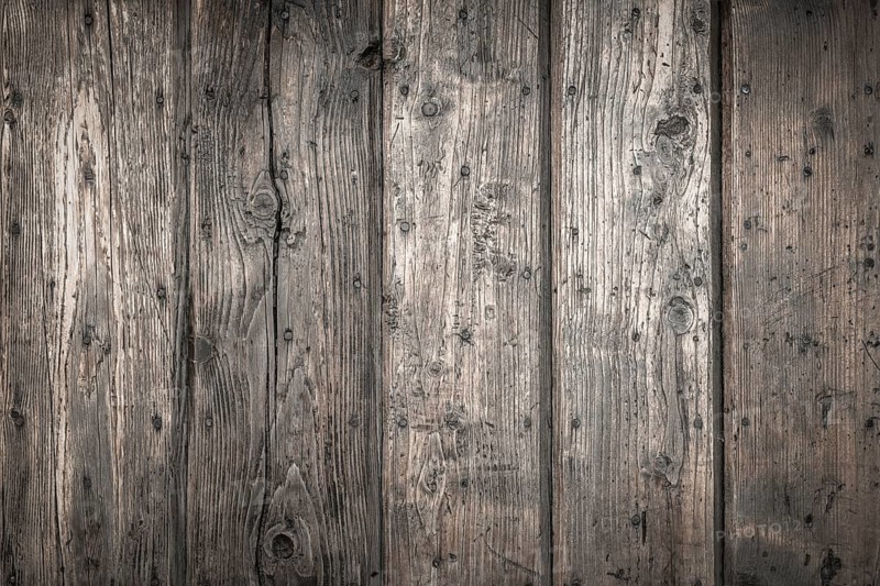 Rough wooden planks, dark and deteriorated by time