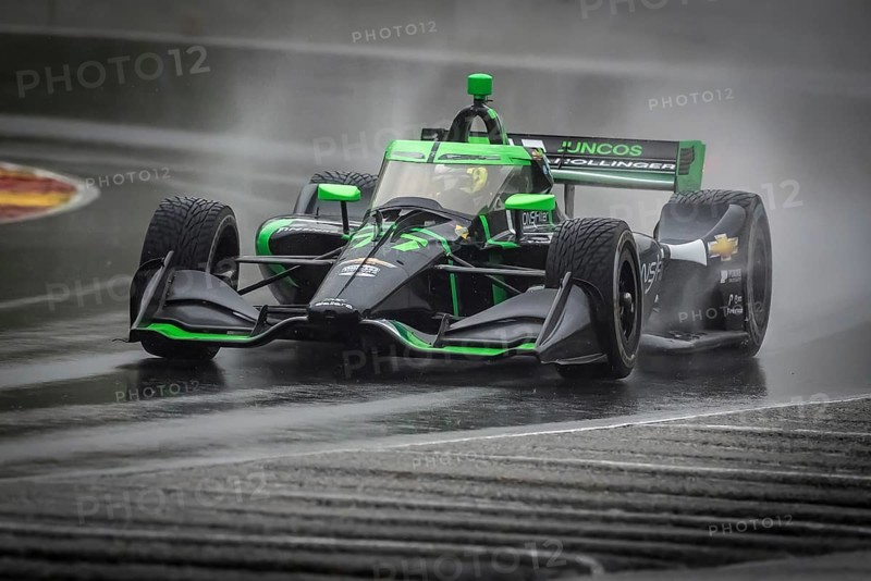 ROMAIN GROSJEAN (77) of Geneva, Switzerland comes through turn 12 (Canada Corner) during a wet practice session for the XPEL Grand Prix at Road America in Elkhart Lake, WI