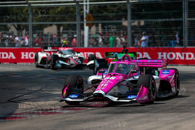 HELIO CASTRONEVES (06) of Sao Paulo, Brazil runs through the streets during the Honda Indy Toronto in Toronto, ON, CAN