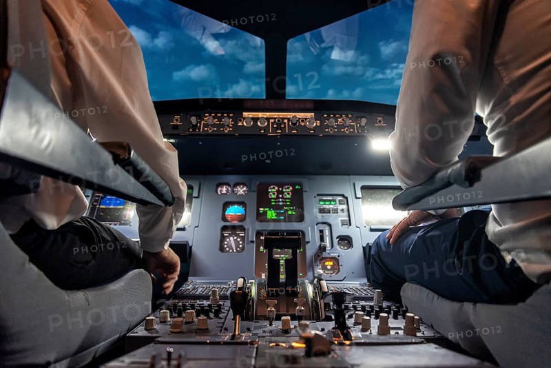 Pilots in the cockpit of an aircraft during a flight
