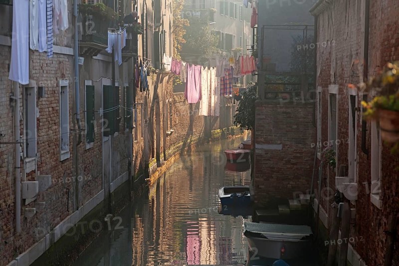 Drying clothes on the rope across venetian channel