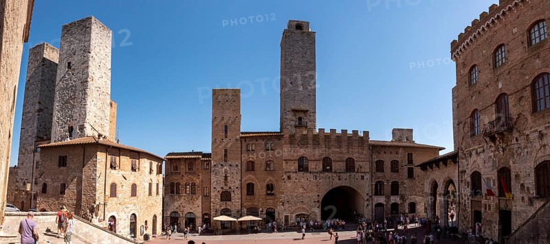 Main square Piazza del Duomo in San Gimignano with its famous palace towers, Italy
