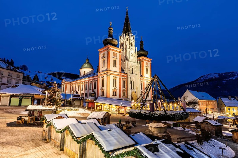 Advent atmosphere, world's largest hanging Advent wreath at the Christmas market in front of the basilica of Mariazell, blue hour in the early morning, Mariazell, Styria, Austria