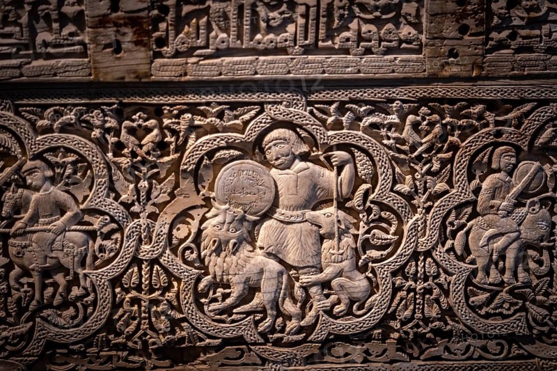 A man on foot, armed with a spear and buckler, rained down against two lionsn Spanish-Arab chest of the Leire monastery, 1004 after Christ. manufactured in the Madinat Al-Zahira workshop