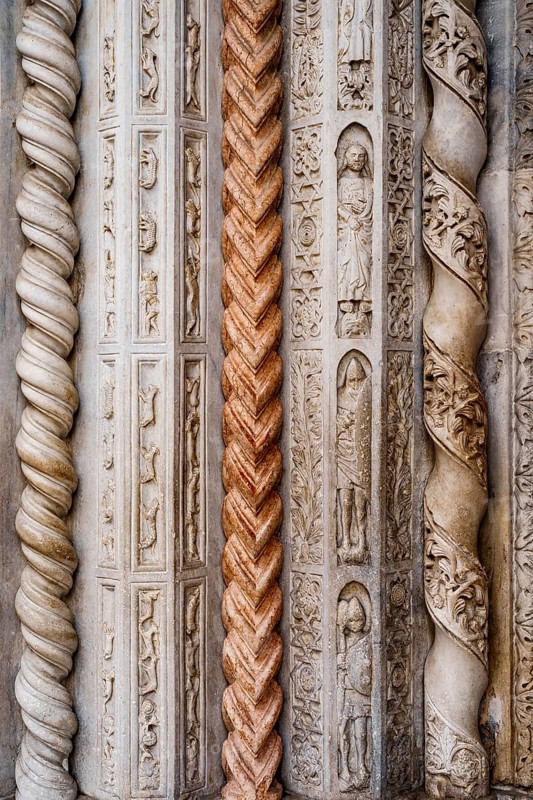 Door details of the columns of the Basilica of Santa Maria Maggiore. Bergamo, Italy.