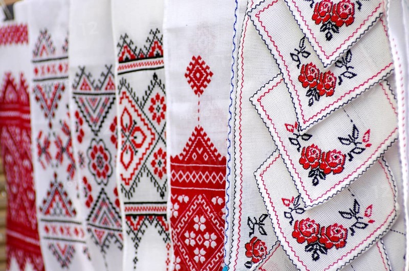 Stock photo of decorative towels with traditional Ukrainian folk national red and black embroidery patterns over white Kiev Ukraine Eastern Europe culture arts and crafts