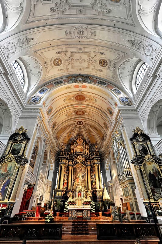 Interior view, central nave, Basilica and pilgrimage church of St. Anna, Altötting, Bavaria, Germany, Europe, Impressive baroque altar with elaborate ceiling decoration and sacred ambience, Chiemgau