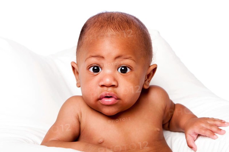 Cute beautiful adorable African baby face with huge eyes on white, Atlanta, USA