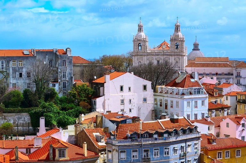 Lisbon, Portugal panoramic aerial view with colorful houses and Estrela Basilica cathedral towers
