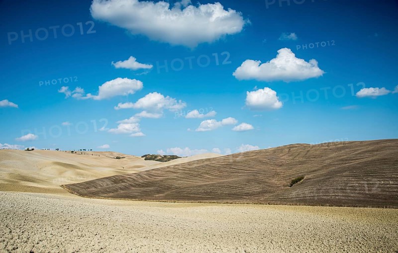 Beautiful idyllic farmland with meadow field at Tuscany area near Pienza touristic village, Italy