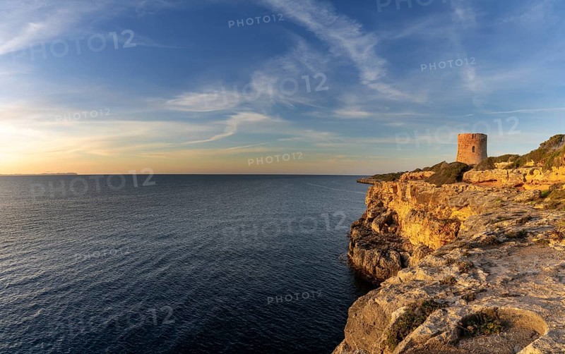 Cala Pi, Spain, 28 January, 2024: view of the historic Cala Pi watchtower in southern Mallorca at sunrise