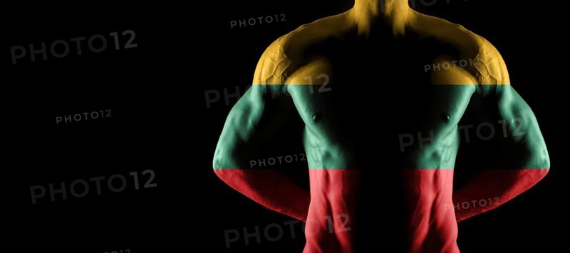 Lithuania flag on muscled male torso with abs, black background