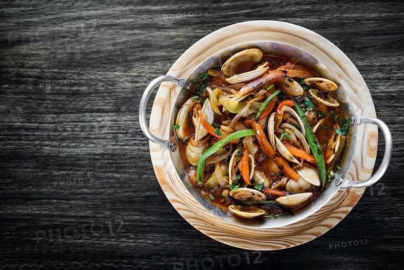 Gourmet portuguese clam and vegetable seafood stew in spicy tomato sauce