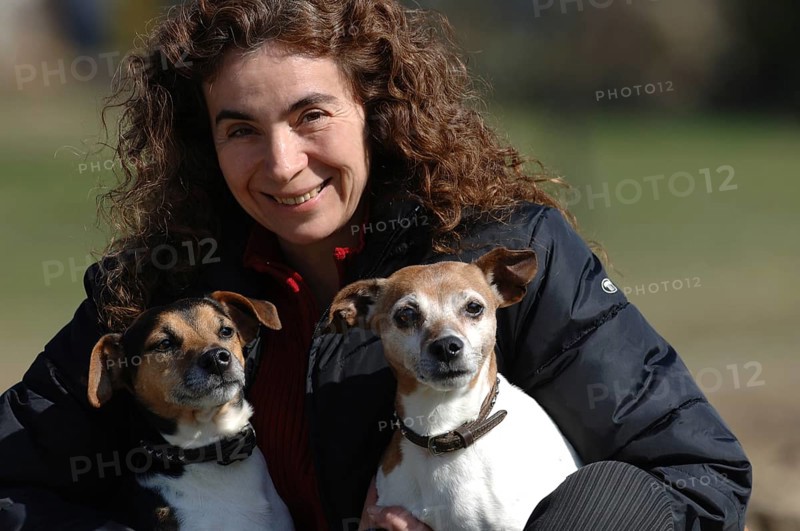 Woman with two Jack Russell terriers