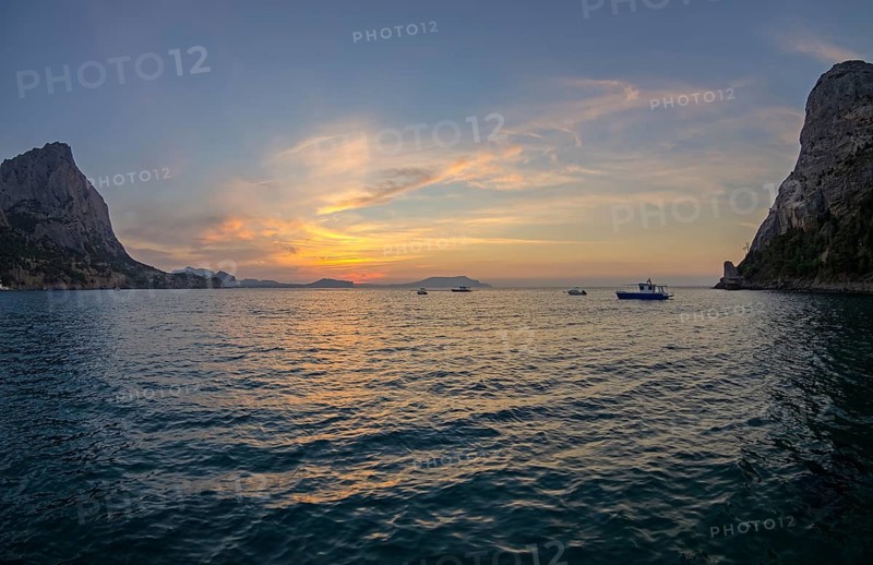 Pacific sunrise in a small bay on the Black Sea coast. Crimea