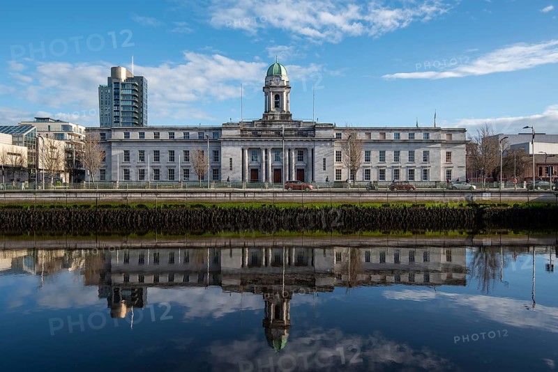 Cork city hall building reflected on river lee. Ireland Europe