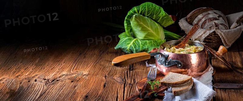 Young and fresh cabbage cooked with bacon cubes
