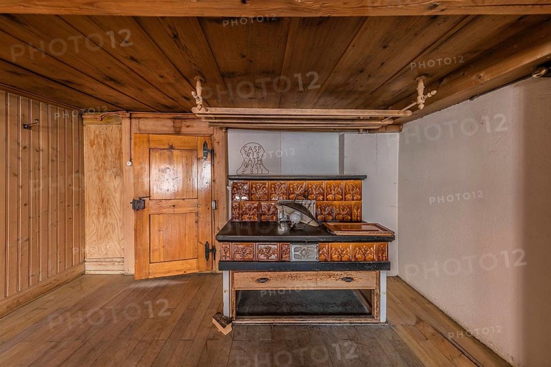 The living room with tiled stove in a house built around 1750 that has since been demolished. Menznau, Lucerne, Switzerland