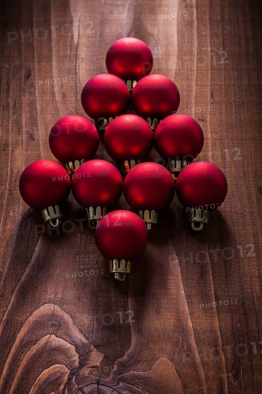 Composition red christmas balls in the form simbold of fir tree