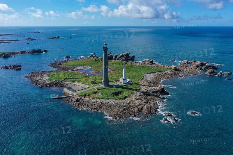 Aerial view island Ile Vierge with lighthouses Phare de l'Ile Vierge, old lighthouse from 1845 and new lighthouse from 1902, with 82, 5 metres highest lighthouse in Europe, off the coast of Plouguerneau, department Finistere Penn-ar-Bed, region Bretagne Breizh, France