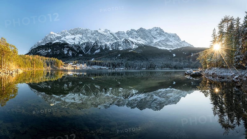 Lake Eibsee Panorama with mountain zugspitze reflection in winter with snow at sunset