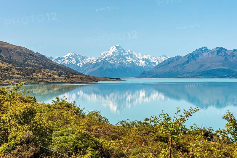 Scenic reflection of Mount Sefton and Mount Cook at lake Pukaki, South Island of New Zealand