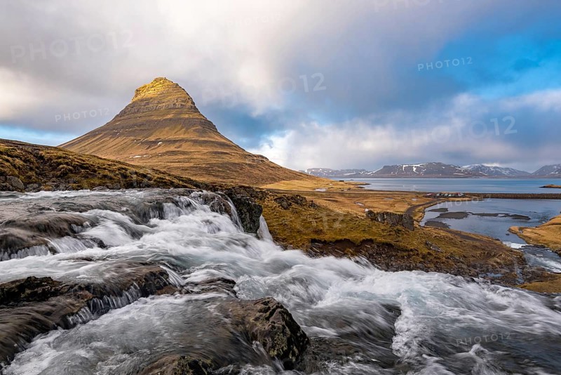 The Kirkjufell mountain and the kirkjufellfoss waterfall at grundarfjordur at Snæfellsnes peninsula in Iceland