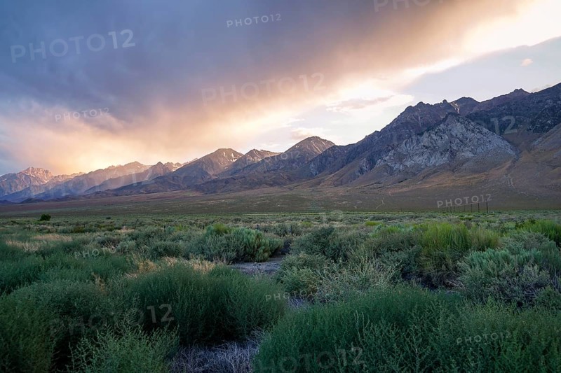 Mountain range with clouded colorful sunset, Eastern Sierra Nevada Mountains, Mono County, California, USA