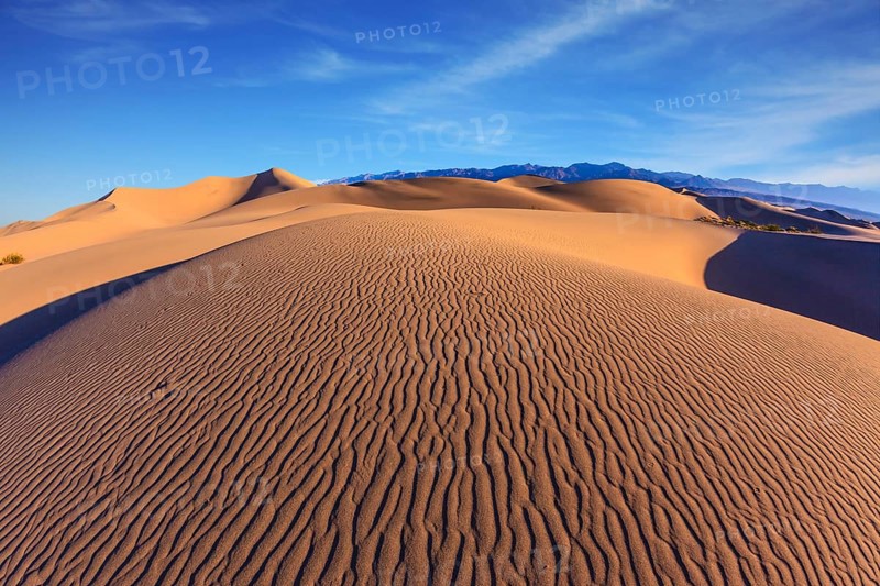 Bright sunny morning in a picturesque part of Death Valley. Thin waves on the sand. Mesquite Flat Sand Dunes
