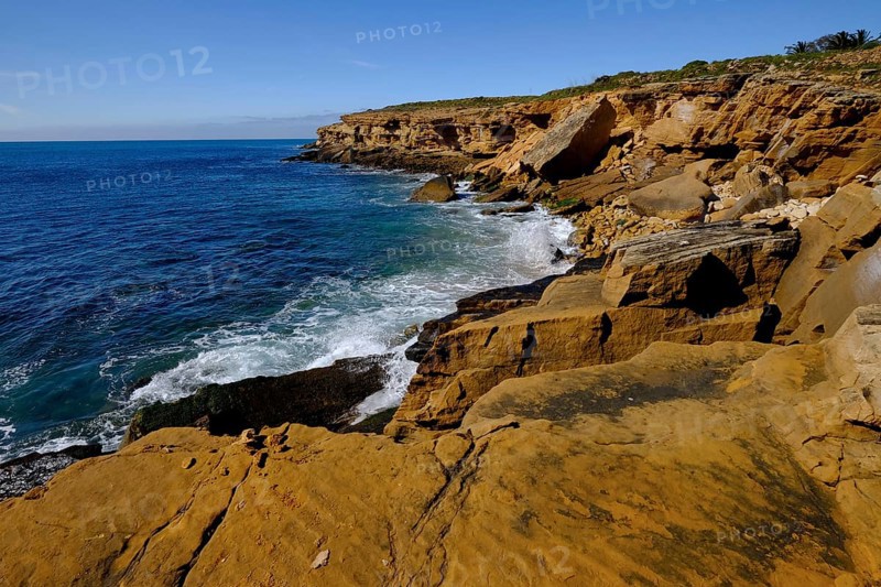 Rocky coast on the Atlantic Ocean between Burgau and Luz, Algarve, Portugal