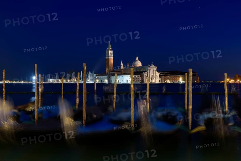 Church of San Giorgio Maggiore with gondolas at night, Venice, Italy