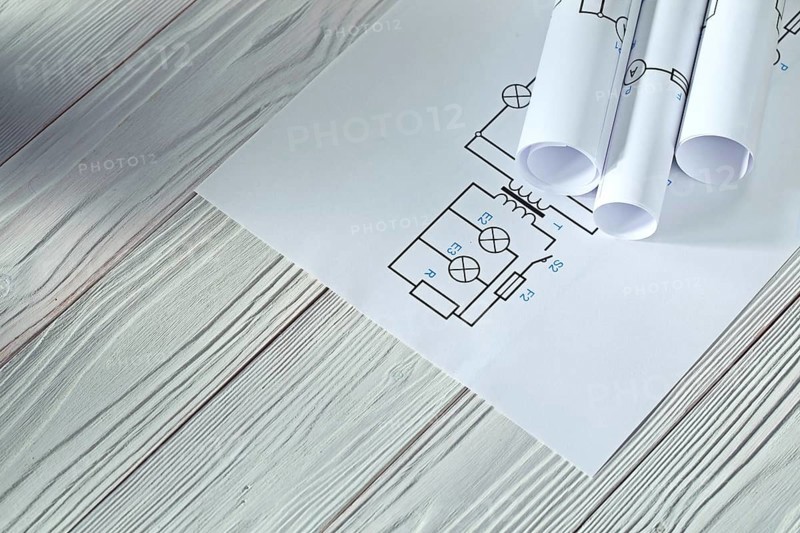 Electrical blueprints on vintage white wood