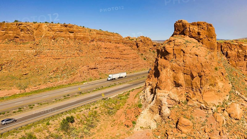 Vehilces Travel along close to the Laguna Pueblo along highway 40 in the desert southwest