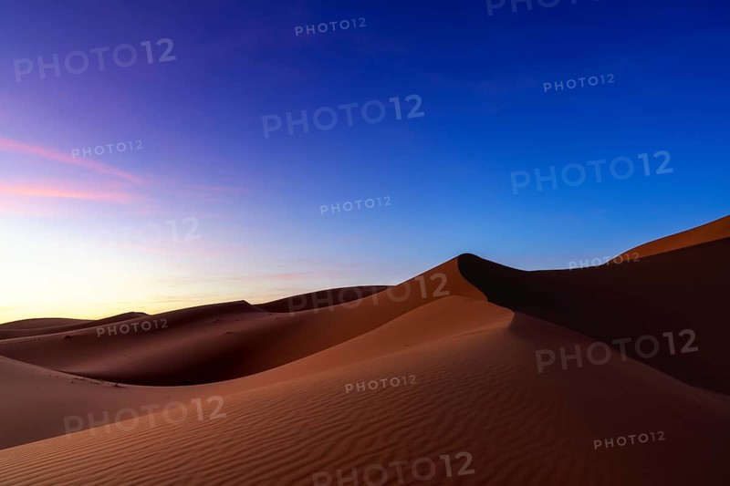 A view of the sand dunes at Erg Chebbi in Morocco at sunset