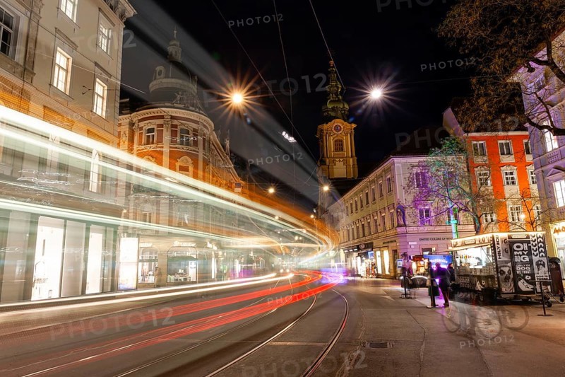 Light traces of a tram in Herrengasse, night shot, Graz, Styria, Austria