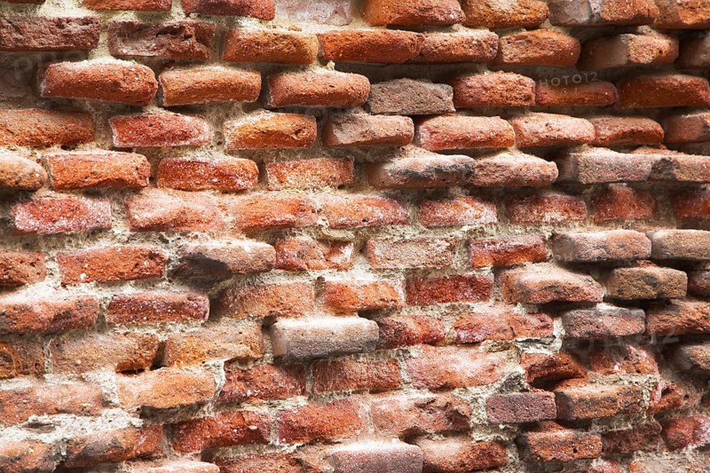 Not restored wall of an old bricklaying