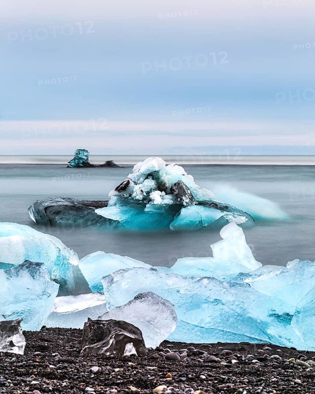 Blue icebergs and chunks floating in a calm ocean scene, iceberg Iceland, glacier, snow, ice rock, ice diamont, glacier lagoon, nature, snow, diamont beach, Iceland